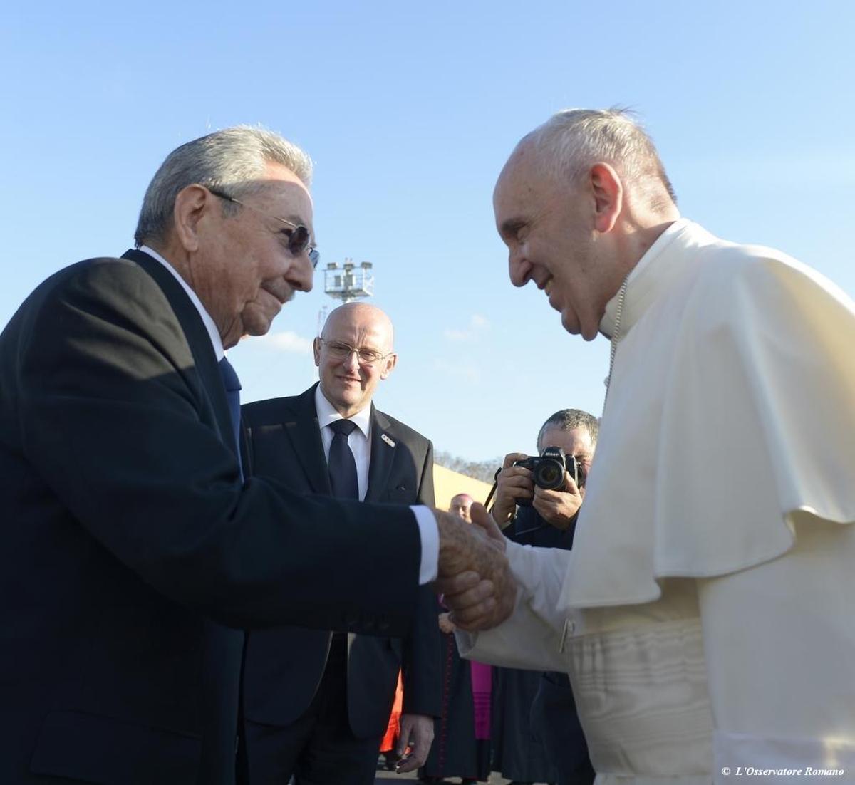 In this photo taken on Friday, Feb. 12, 2016, Pope Francis, left, meets with Cuban President Raul Castro, at the Jose Marti airport in Havana, Cuba.