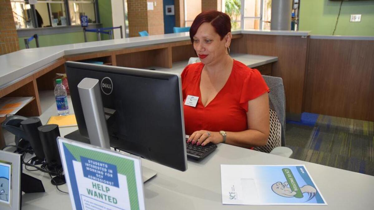 Sheila Bing, a student ambassador, works at State College of Florida’s front desk in the Korcheck building and gives student tours.
