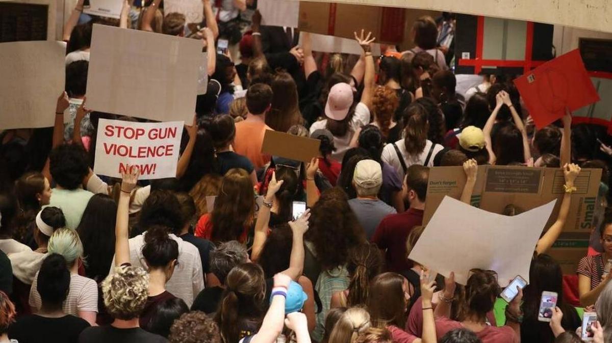 FILE, Feb. 21, 2018: After no luck at the governor's office, students storm the Florida House of Representatives chambers in Tallahassee, chanting "vote them out" and "we're students united, we'll never be divided."