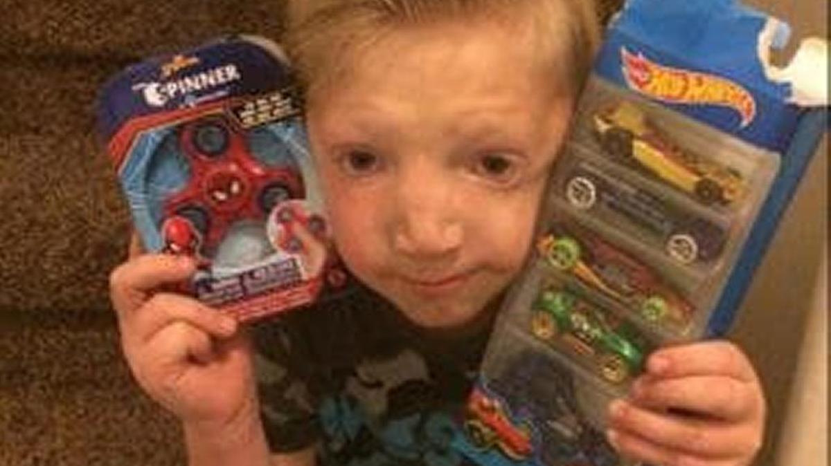 Jackson Bezzant with gifts from neighbors who heard about the bullying he faced in school.