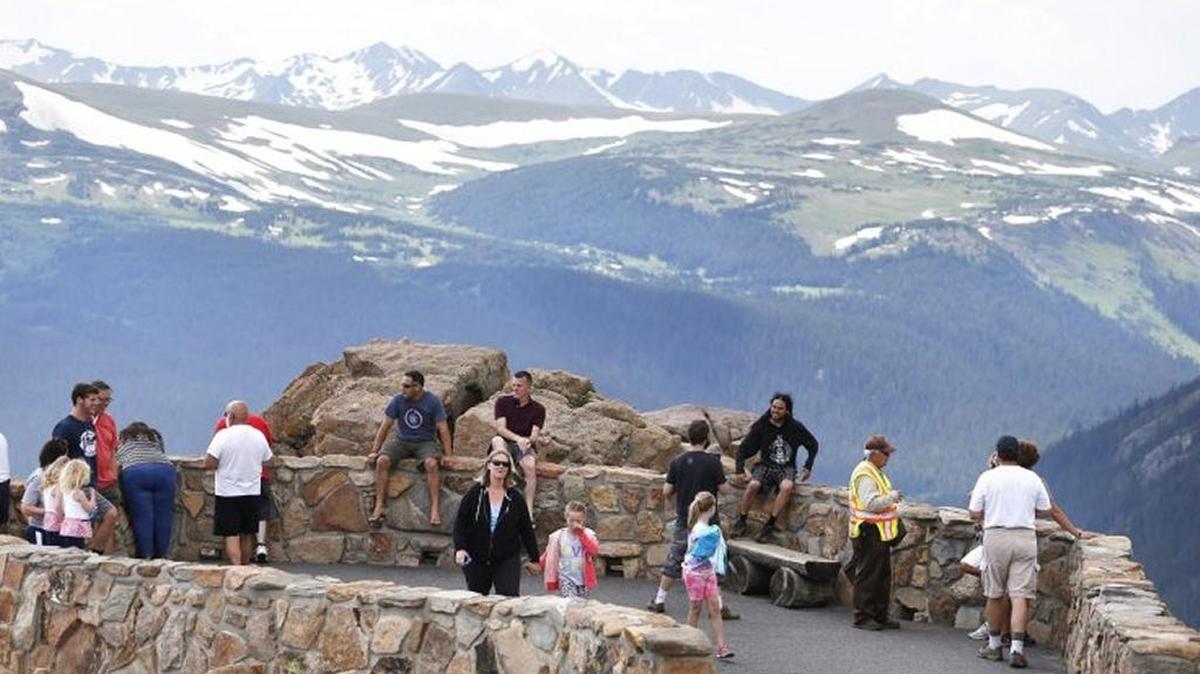 FILE PHOTO: Visitors take in a scenic overlook off Trail Ridge Road, above tree-line at Rocky Mountain National Park, west of Estes Park, Colo., in July 2014.