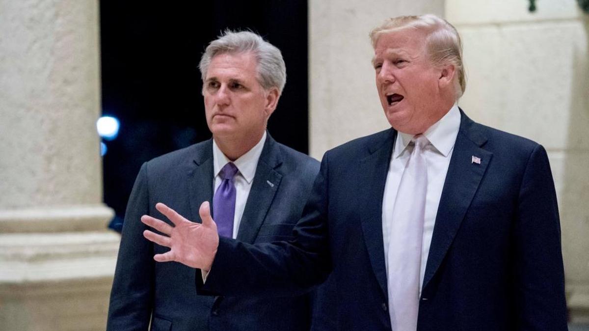 President Trump, accompanied by House Majority Leader Kevin McCarthy, R-Calif., speaks to members of the media as they arrive for a dinner at Trump International Golf Club in West Palm Beach, Fla., in January, 2018.