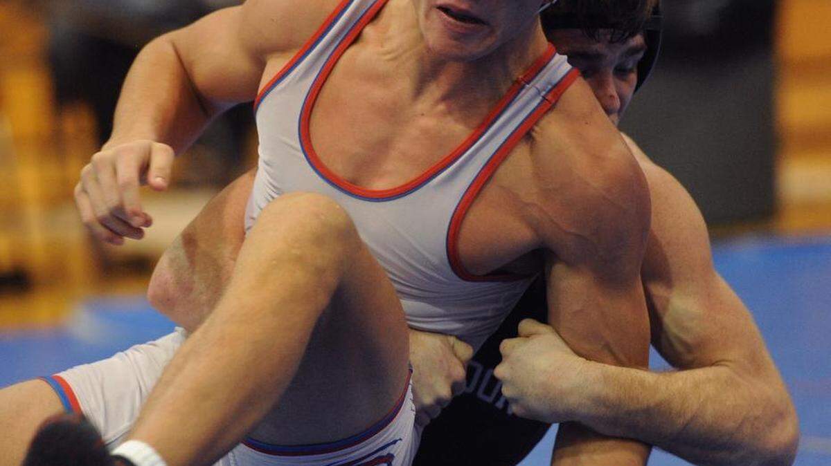 Manatee High's Caleb Rudisill wrestles Brandon High's Kyle Norstrem in a match Saturday during the Manatee Hurricane Team Challenge wrestling tournament. GRANT JEFFERIES/Bradenton Herald