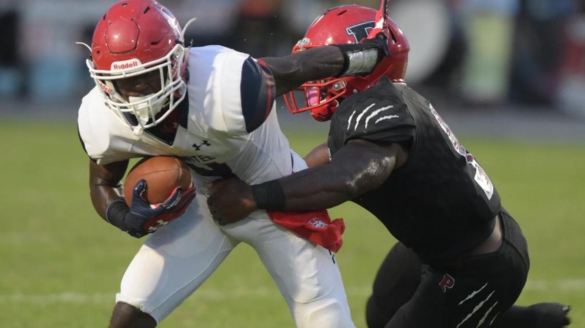 Palmetto linebacker Alonzo Houston, right, tallied 115 tackles, including 18 for a loss, and added six sacks and three interceptions in helping the Tigers reach the Class 7A playoffs.