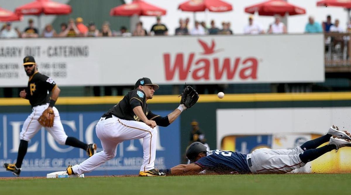 Pittsburgh Pirates shortstop Max Moroff prepares to tag out the Minnesota Twins’ Eddie Rosario at second base during Monday’s game at LECOM Park.
