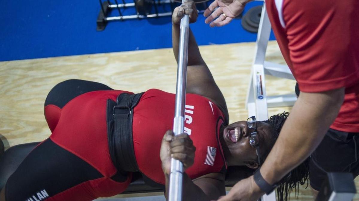 Palmetto’s Sha’la McMillan shouts as she wins the unlimited weight class bench press event at the Manatee County’ Girls Weightlifting Championship in December.