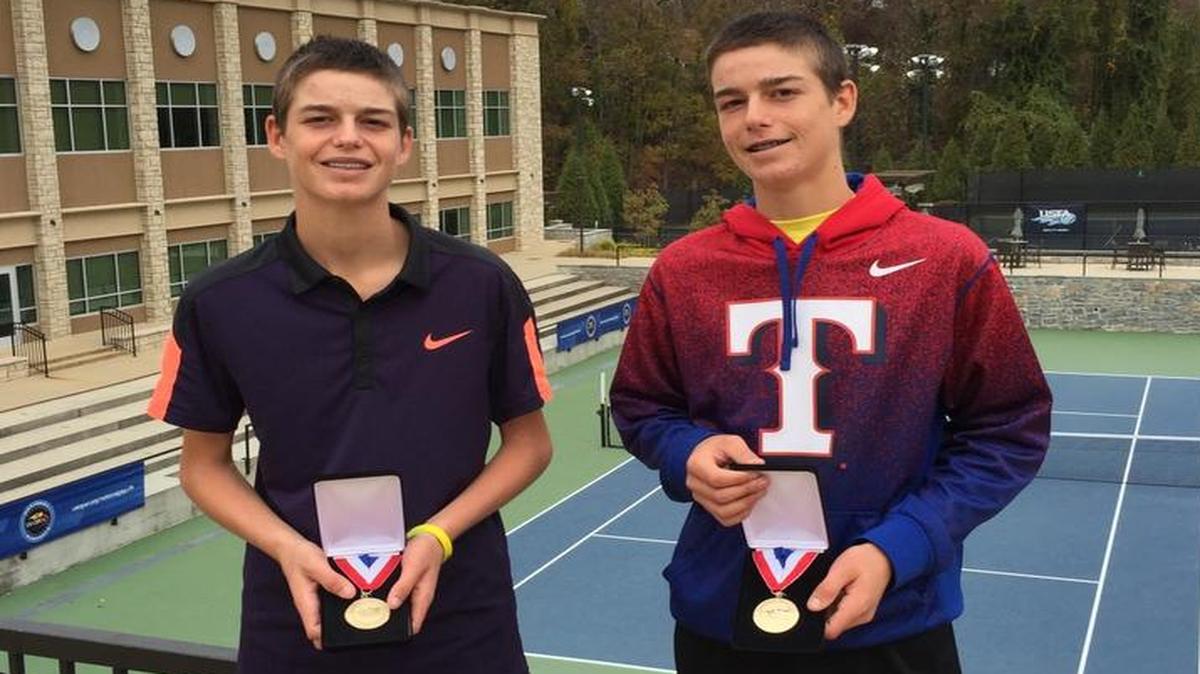 Connor Krug and Jake Krug pose with their medals after winning the 14s doubles championship at the United States Tennis Association National Selection Tournament in November.