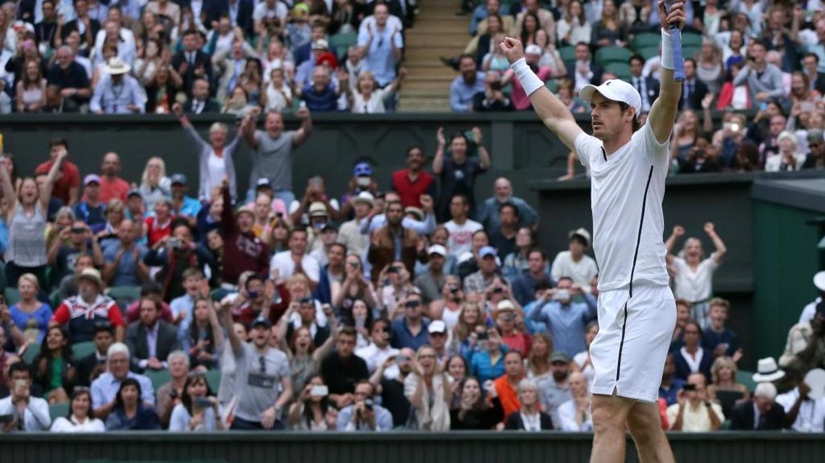 Andy Murray celebrates after defeating Jo-Wilfried Tsonga during their men’s singles quarterfinal match on day 10 of the Wimbledon Tennis Championships in London on Wednesday.
