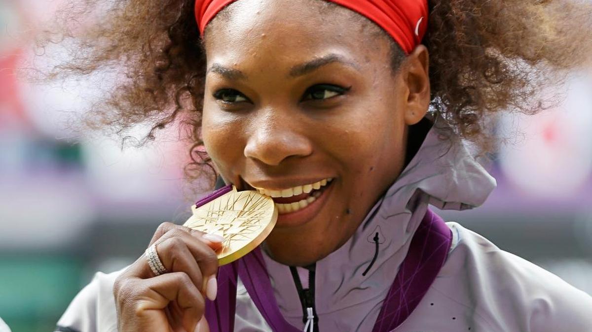 This Aug. 4, 2012 file photo shows Serena Williams posing with her 2012 Summer Olympics gold medal during the medal ceremony for women’s singles tennis at the 2012 Olympics in London. Serena Williams will be competing in Rio.