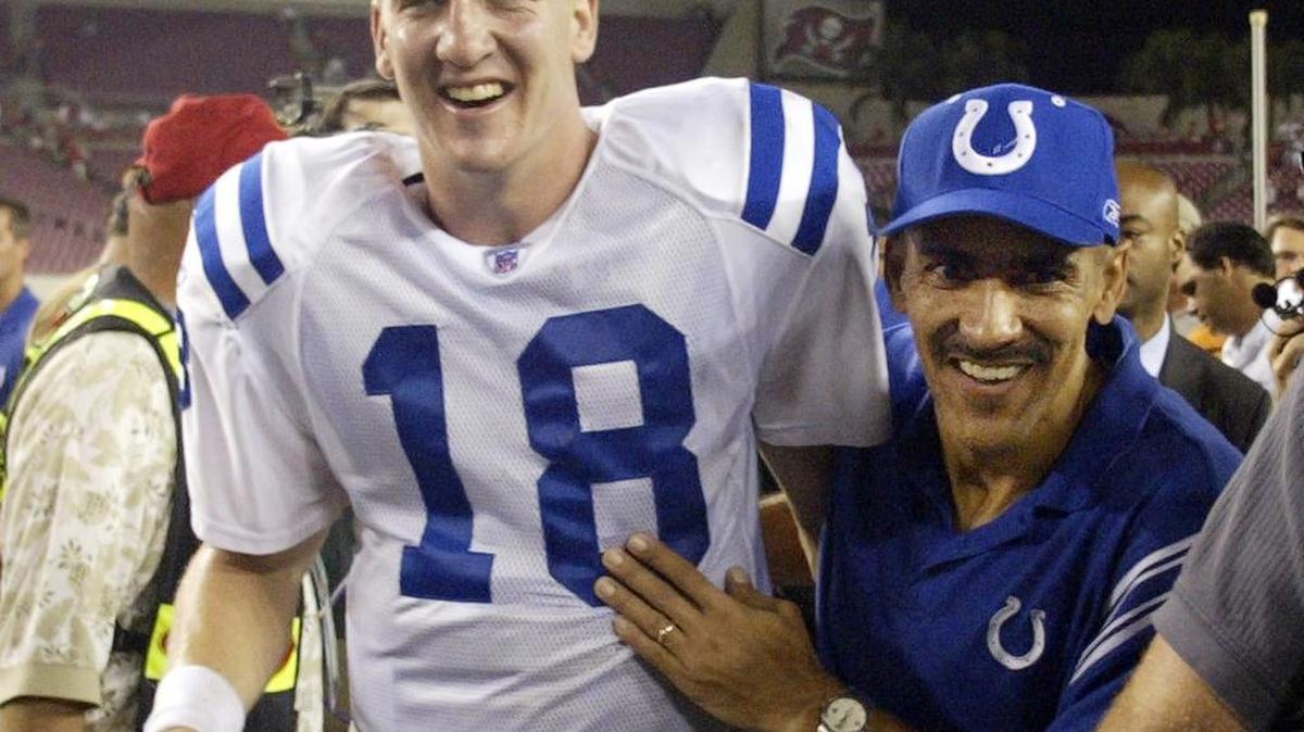 In this Oct. 7, 2003, file photo, Indianapolis head coach Tony Dungy, right, and quarterback Peyton Manning celebrate following the team’s 38-35 overtime win against the Tampa Bay, in Tampa. Dungy’s even temperament and insistence on players doing things the “right way” not only helped him survive his only losing season to lead Tampa Bay to four playoff berths in six seasons, but also become the first African-American to win a Super Bowl as a head coach during a stellar seven-year run with the Indianapolis Colts.