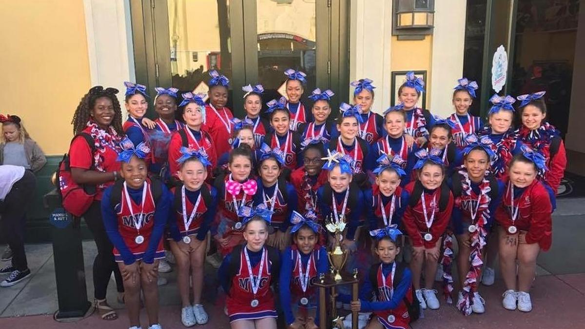 The Manatee Wildcats pose with their runner-up trophy after finishing second in the Division 2 junior varsity large championship at ESPN Wide World of Sports Complex.