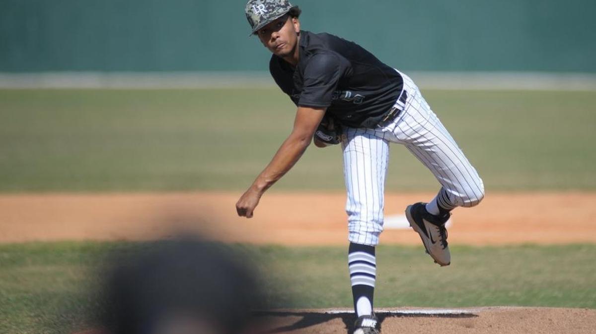 Starting pitcher Pablo Garabitos throws a warm-up pitch during a regular-season game. Garabitos is one of two local athletes invited to USA Baseball’s Breakthrough Series camp at Pirate City Wednesday through Friday.