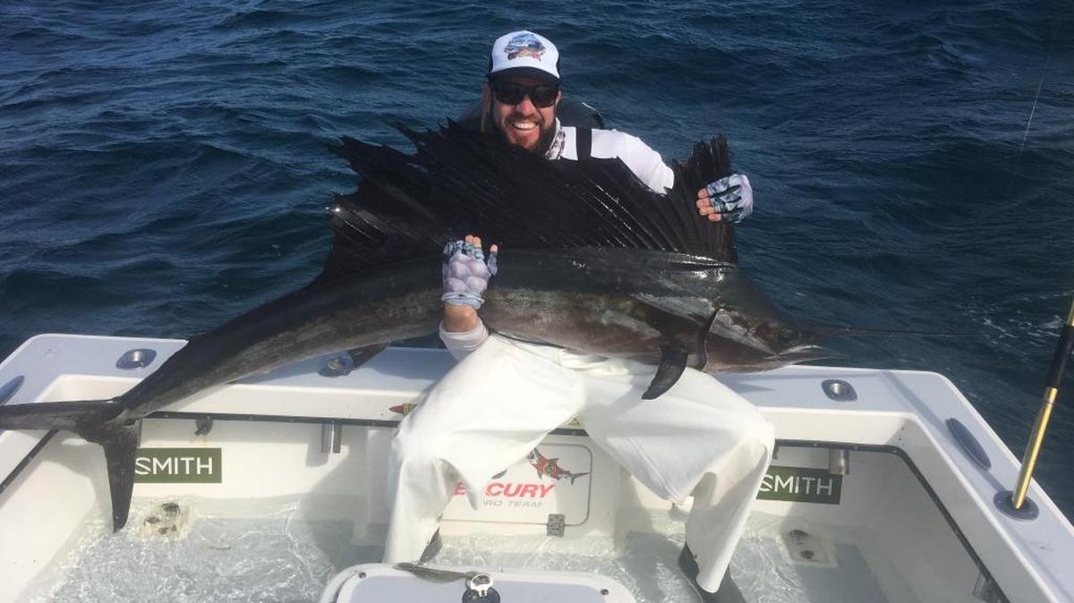Capt. Jason Stock poses with a sailfish he caught this past week approximately four miles west of Anna Maria Island.