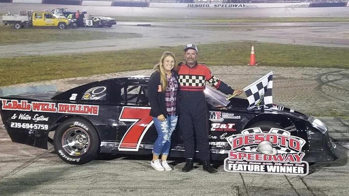 Danny Caylor poses in the winner’s circle at Desoto Speedway after pulling away in the closing laps to win the 25-lap Street Stock feature on Saturday night.