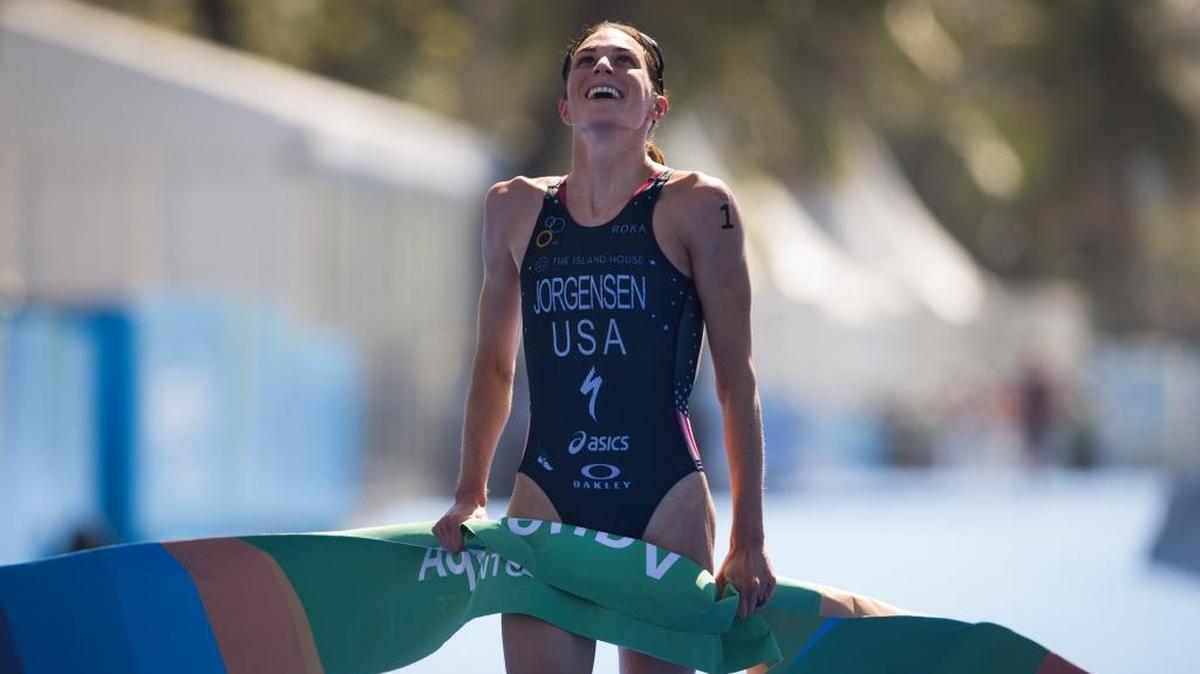 Gwen Jorgensen of the United States celebrates Aug. 2, 2015, after crossing the finish line to win the women's triathlon ITU World Olympic Qualification Event in Rio de Janeiro, Brazil.