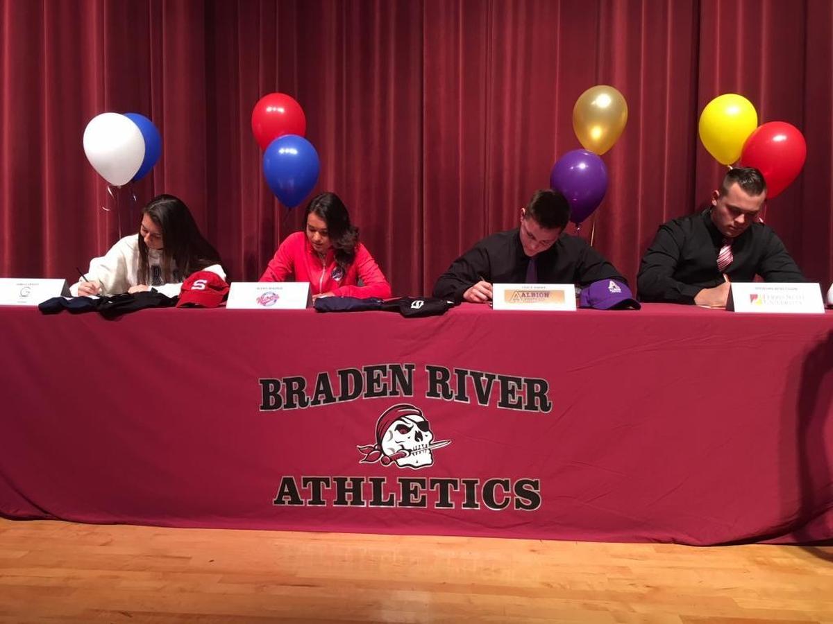 Braden River High girls soccer players and football players signed Wednesday. From left to right: Isabelle Vazquez (Gordon State), Alexis Madrid (Florida Southern), Chase Knopf (Albion) and Brendan Bengtsson (Ferris State).