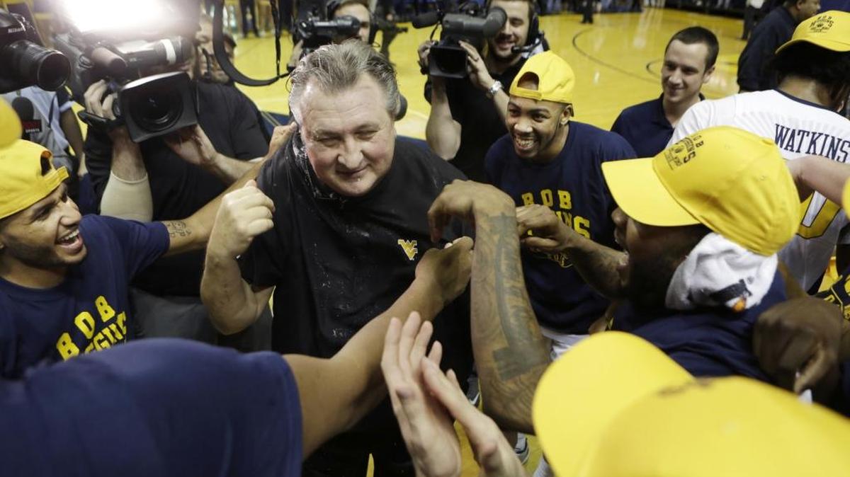 West Virginia head coach Bob Huggins celebrates his 800th career win in December in Morgantown, W.Va. Huggins has raised funds to fight cancer since losing his mother to the disease in 2003.