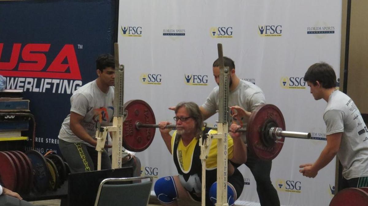 Bradenton’s Kenneth Carlisle sets up for a squat at the Sunshine State Games in Palmetto on Saturday.