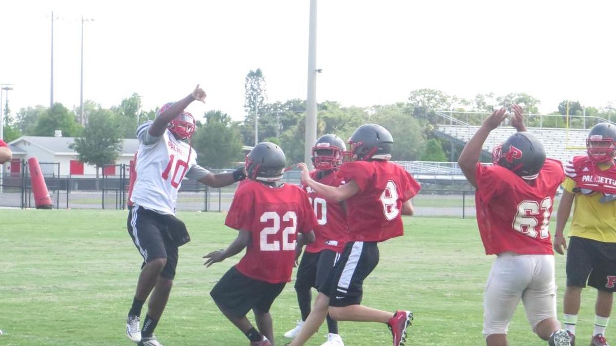 Rising junior quarterback Jason Spicer throws a screen pass during Palmetto practice Wednesday.