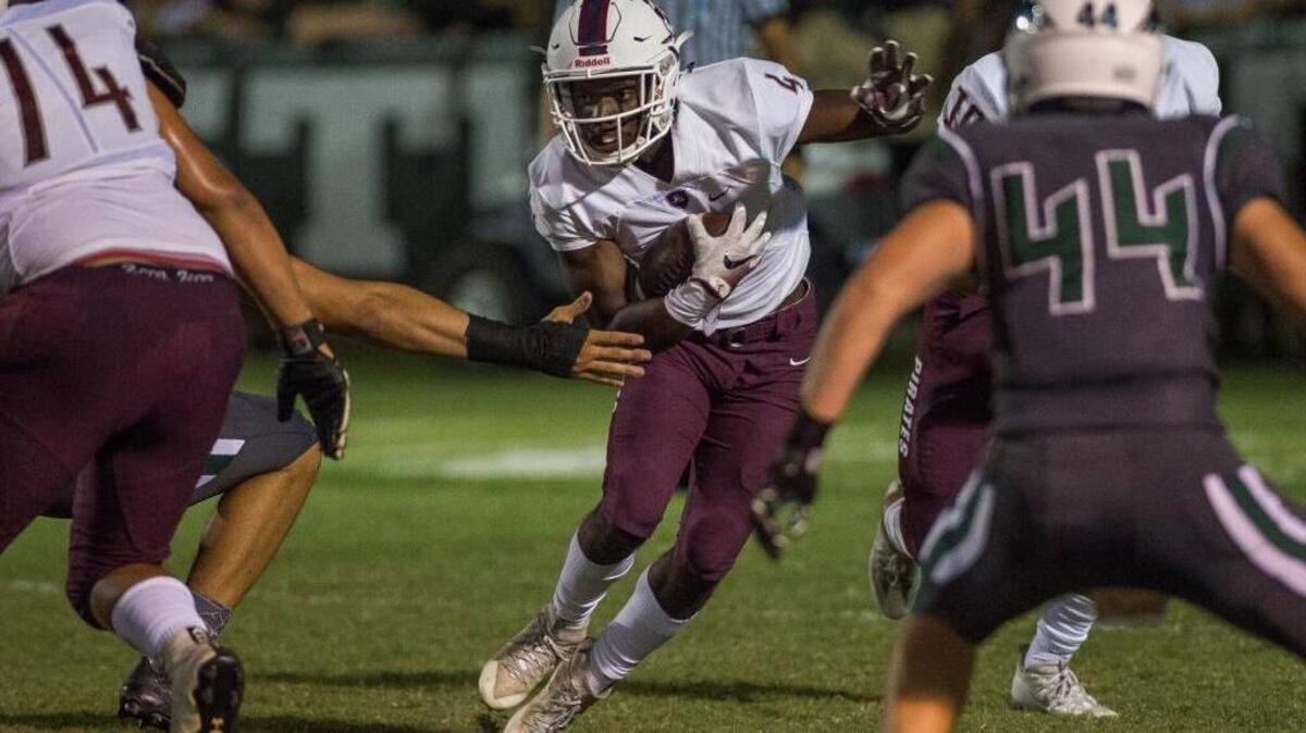 Braden River’s Raymond Thomas jukes out Venice defenders during the teams’ first encouter this season on Oct. 14.