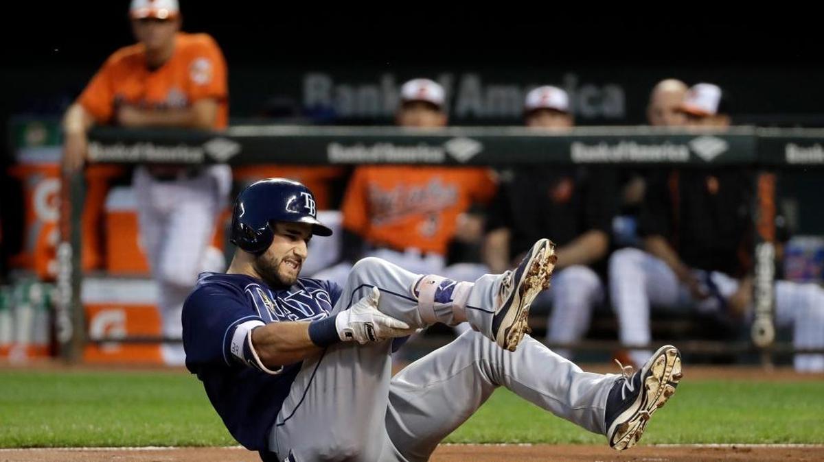 Tampa Bay’s Kevin Kiermaier gets up after falling when he was hit by a pitch during Saturday’s game against Baltimore.