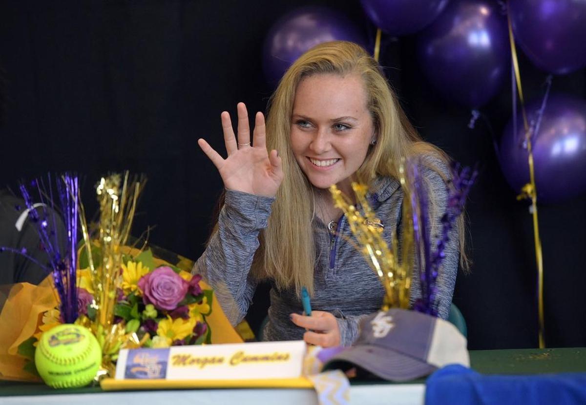 Morgan Cummins waves to friends during signing day at Lakewood Ranch High on Wednesday.