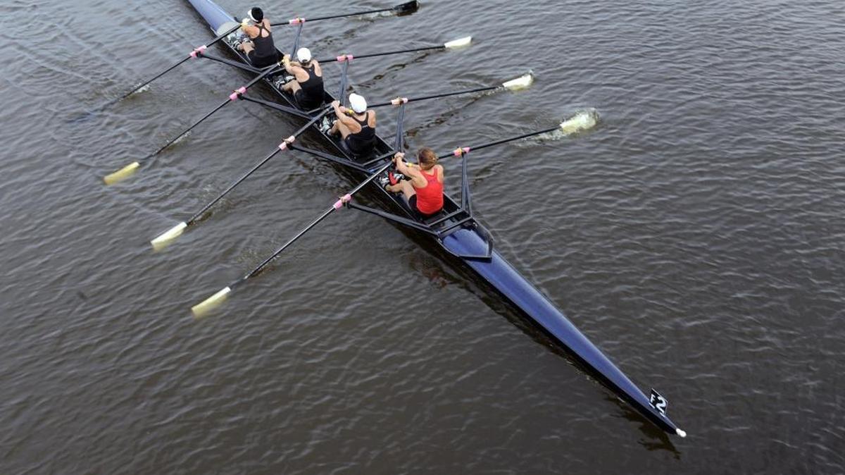 Rowers pass underneath one of the bridges after their race on the first day of the Masters Rowing Championship at Nathan Benderson Park.