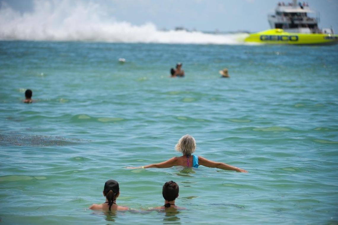 Spectators in the Gulf of Mexico watch as the boats speed by at a previous Sarasota Powerboat Grand Prix.