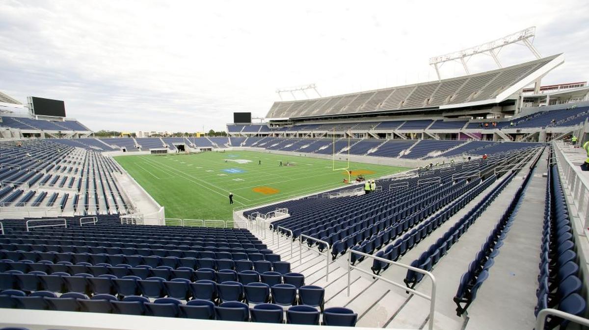 A grounds crew works on the football field at the new Citrus Bowl stadium in Orlando in November 2014. The NFL is moving the Pro Bowl from Honolulu to Orlando this season, three people with knowledge of the negotiations told The Associated Press on Tuesday.