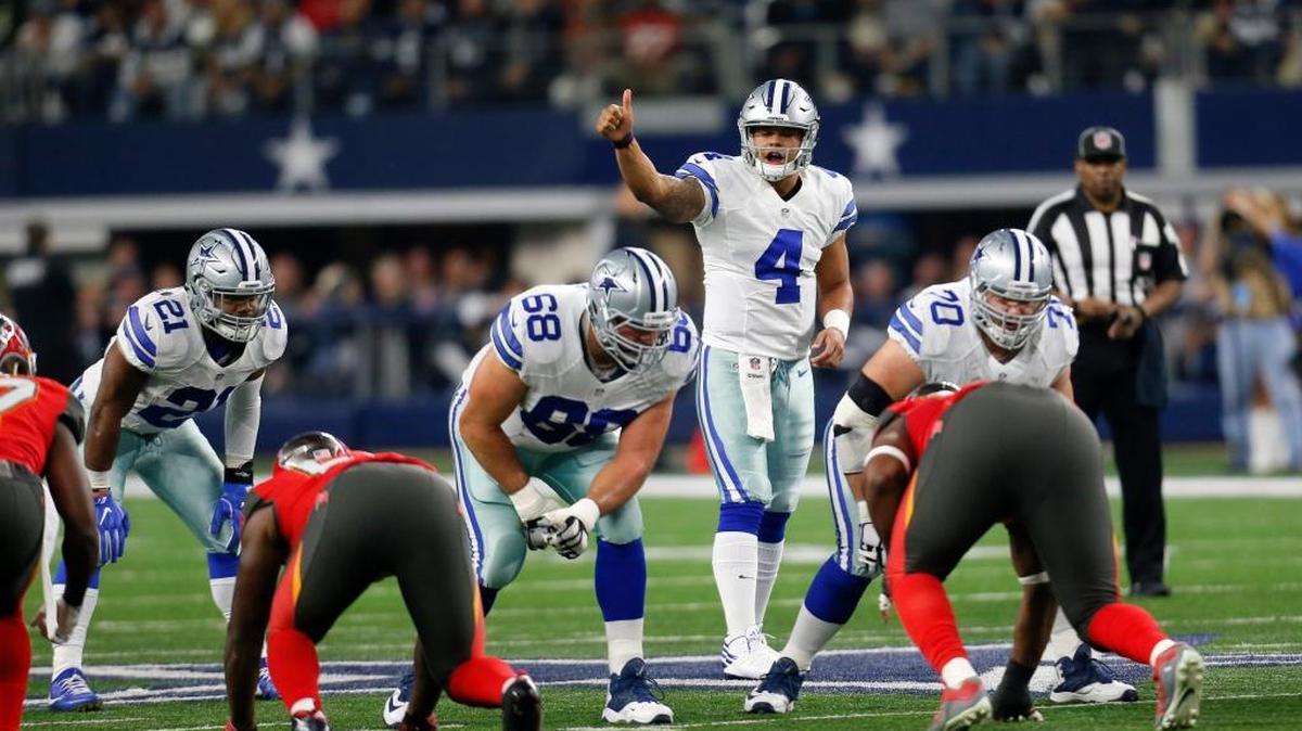 Dallas quarterback Dak Prescott signals at the line of scrimmage during a game against Tampa Bay on Dec. 18 in Arlington, Texas. Prescott leads the Cowboys into today’s NFL playoff game against Green Bay.