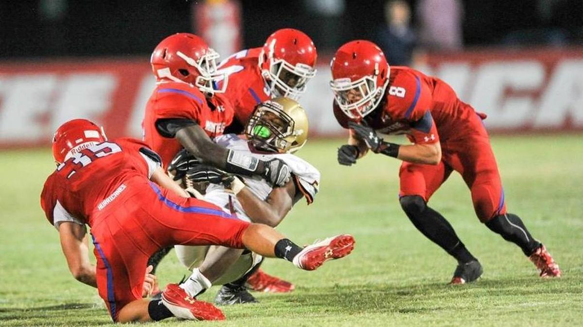 Manatee defenders tackle Clearwater Countryside running back Try Reeves during the spring game May 27 at Joe Kinnan Field. The Canes play their preseason game at home Friday against Seffner Armwood. Kickoff is 7:30 p.m.