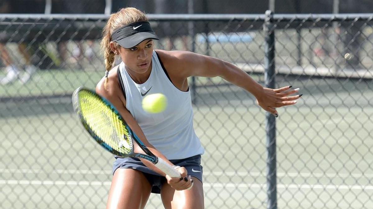 Bradenton's Whitney Osuigwe plays in a doubles match at the Eddie Herr International Tennis Tournament at IMG Academy Wednesday.