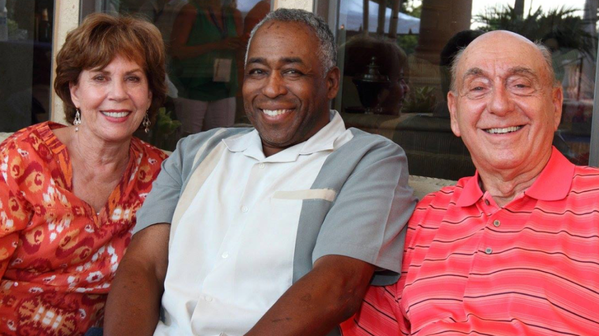 Sportscaster John Saunders, center, attends a post-gala party last year with Lorraine and Dick Vitale at their Lakewood Ranch home.Saunders, who died in August, was a founding member of the V Foundation for Cancer Research board of directors.