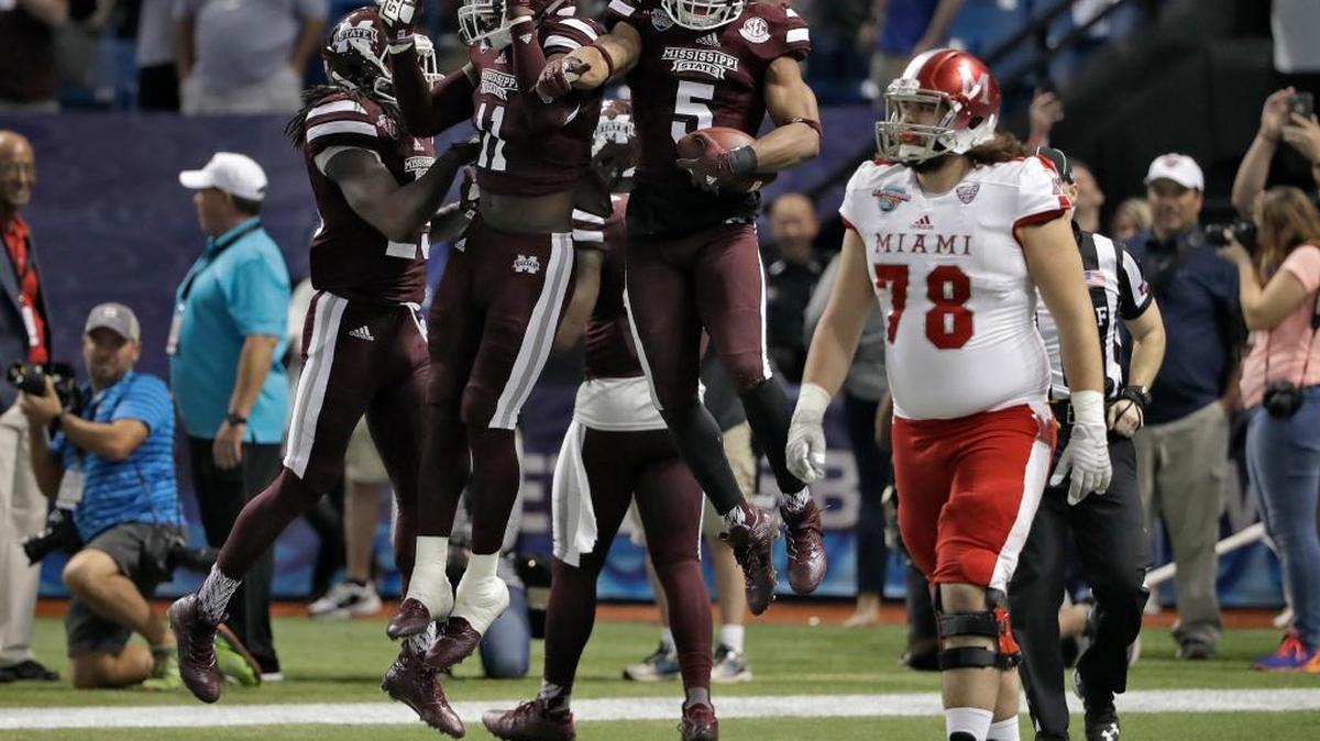 Mississippi State defensive back Cedric Jiles (5) celebrates with teammates as he holds the football after recovering a blocked field goal.