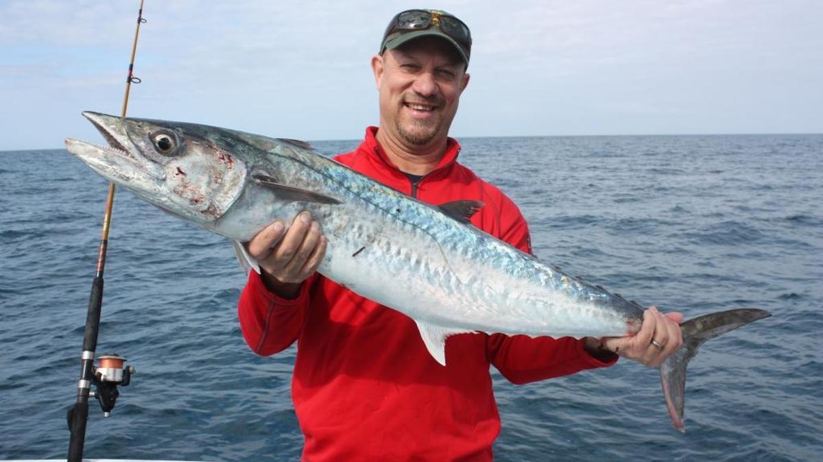 Ike Lovelass from Syracuse, N.Y., showing some love to his smoker kingfish he caught. We were using sardines in about 40 feet offshore of Anna Maria Island.