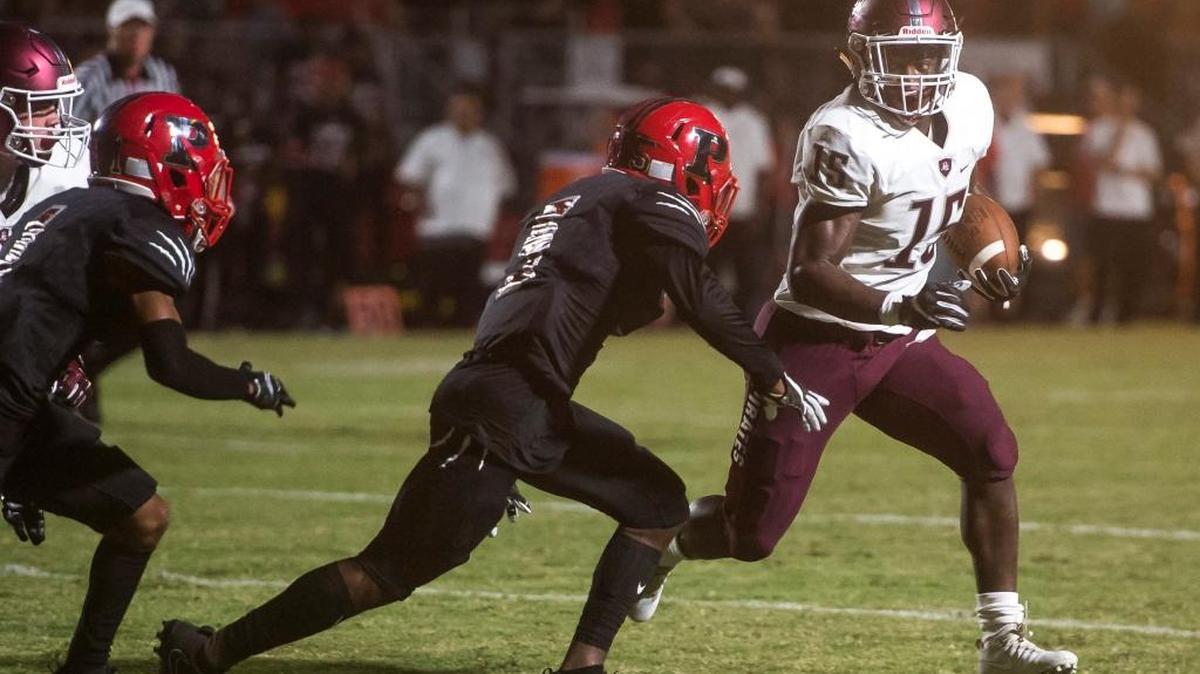Braden River’s Knowledge Mcdaniel evades Palmetto defenders during an Oct. 6 game in Palmetto. He finished with 10 catches for 210 yards and two touchdowns.