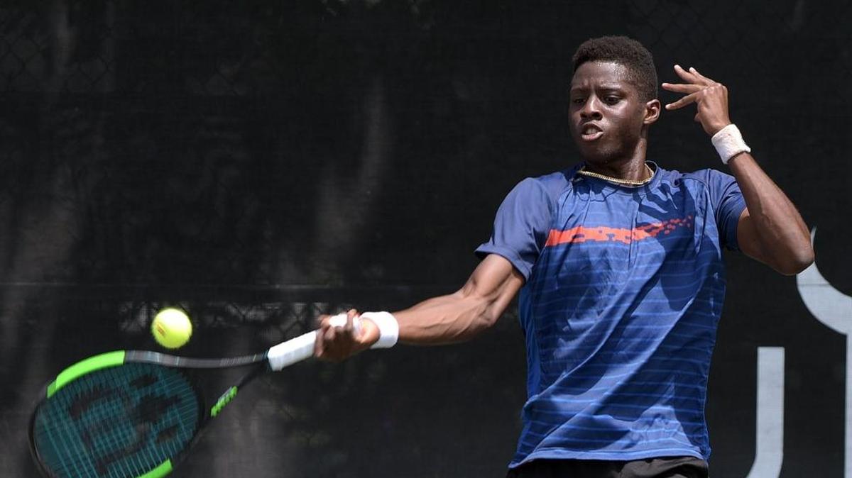 Bradenton native Sekou Bangoura plays a match against James McGee on the first day of the main draw of the Sarasota Open held at the United Tennis Academy in Bradenton Monday.