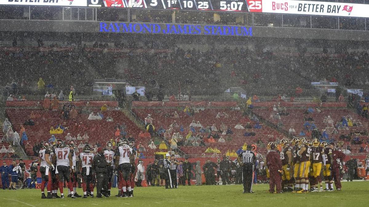 Tampa Bay and Washington play each other in a driving rain storm Wednesday in Tampa.