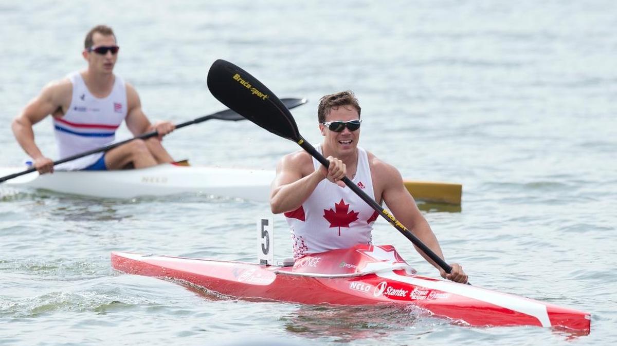 In this Aug. 10, 2014, file photo, Canada’s Mark De Jonge, right, rides his canoe after winning at the K1 men 200-meter final of the ICF Canoe Sprint World Championships 2014 in Moscow, Russia. After winning bronze in London, the 32-year-old engineer heads to Rio as a double world champion and world-record holder in the event, which he has compared to a drag race on water.