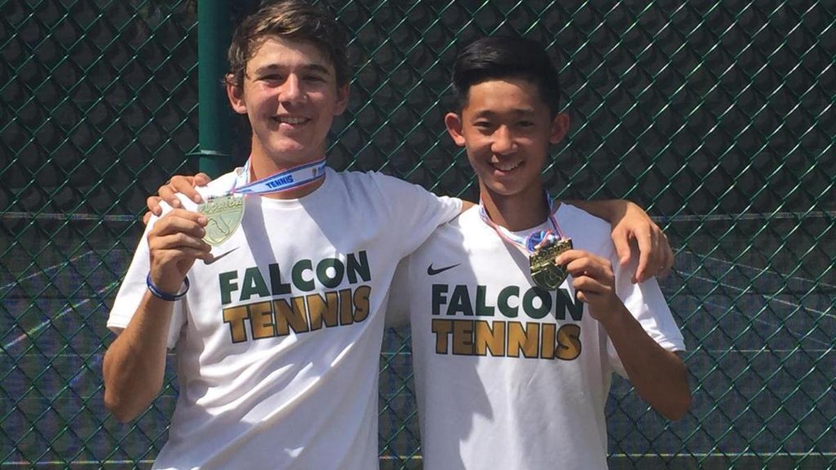 Saint Stephen’s Max Damm (left) and Chenhe (Dan) Li hold their state championship gold medals after beating Fort Lauderdale Calvary Christian’s Michael Mendez and Sebastian Stam, 6-7, 6-4, 11-9, in the Class 1A state doubles championship match in Sanford on Tuesday.