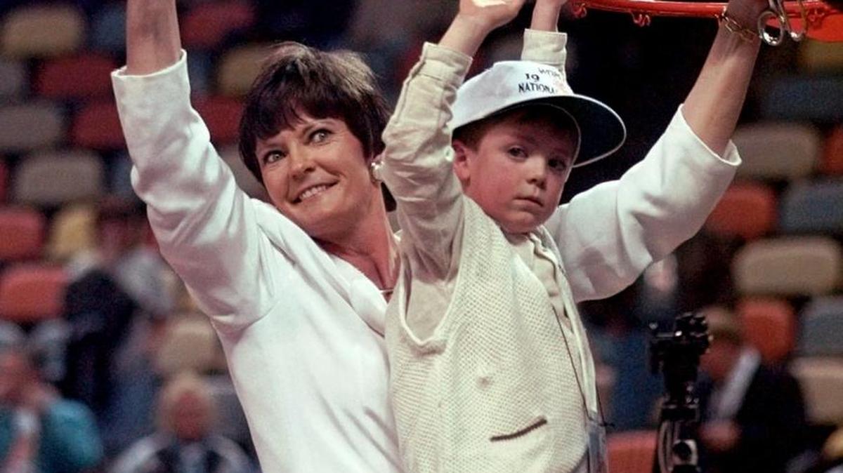 In this March 30, 1997, file photo, Tennessee head coach Pat Summitt holds up the net with her son Tyler after the Lady Vols defeated Old Dominion 68-59 to win the NCAA Division I Women’s Final Four Tournament in Cincinnati. Summitt, the winningest coach in Division I college basketball history who uplifted the women's game from obscurity to national prominence during her career at Tennessee, died Tuesday morning. She was 64.