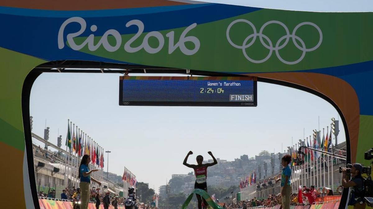 Jemima Jelagat Sumgong, of Kenya, celebrates as she crosses the finish line to win the gold medal in the womens marathon at the 2016 Summer Olympics in Rio de Janeiro, Brazil, Sunday.