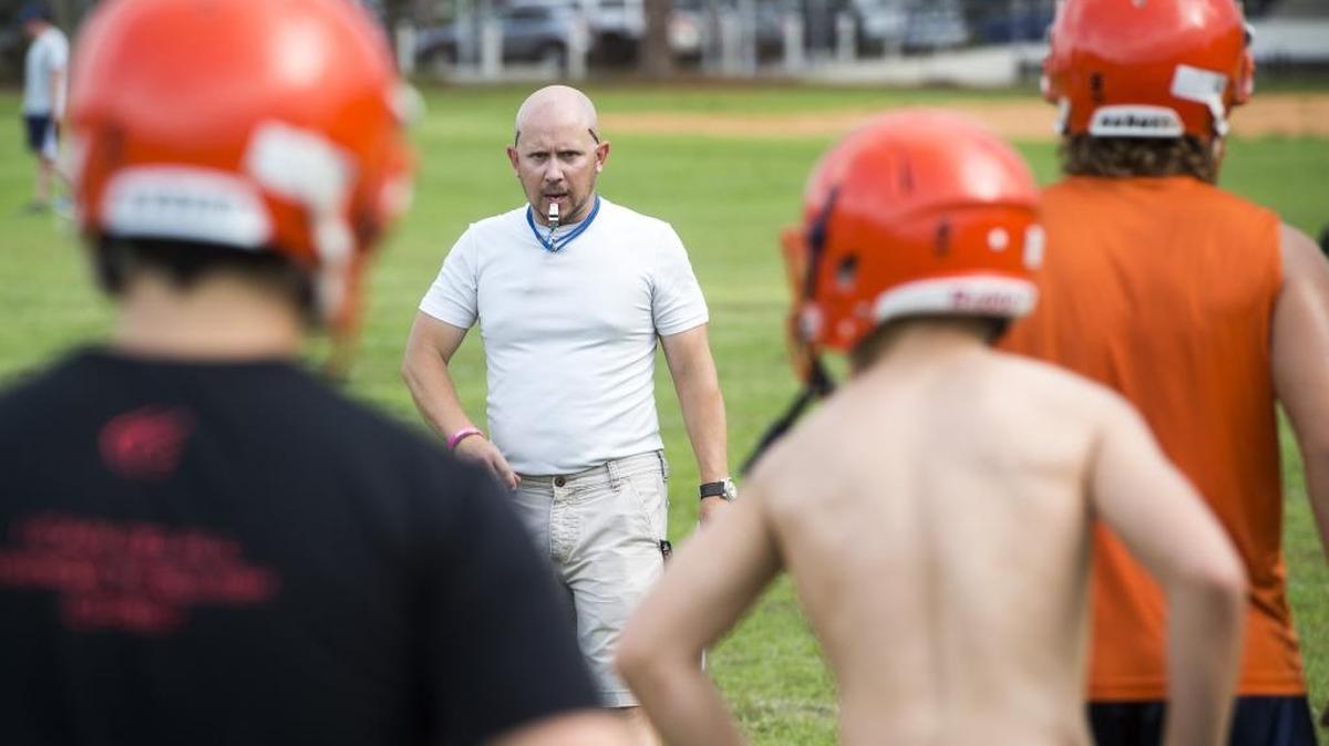 Head Coach Dan Fort blows his whistle during warmups at Bradenton Christian’s football practice on Thursday.