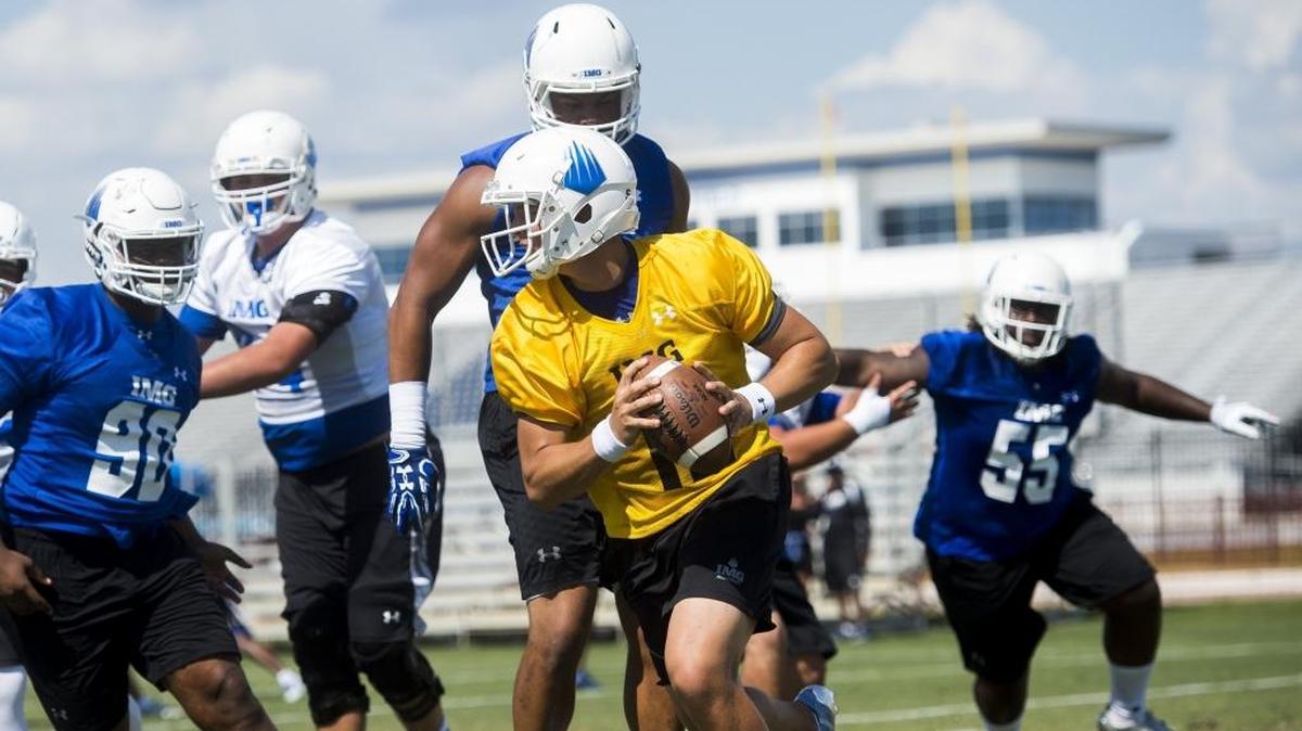 Players run drills during IMG Academy’s football practice on Wednesday afternoon at IMG Academy in Bradenton. Approximately 120 athletes are expected to start practice for the fall football season at the school, prompting officials to flaunch a second varsity football team.
