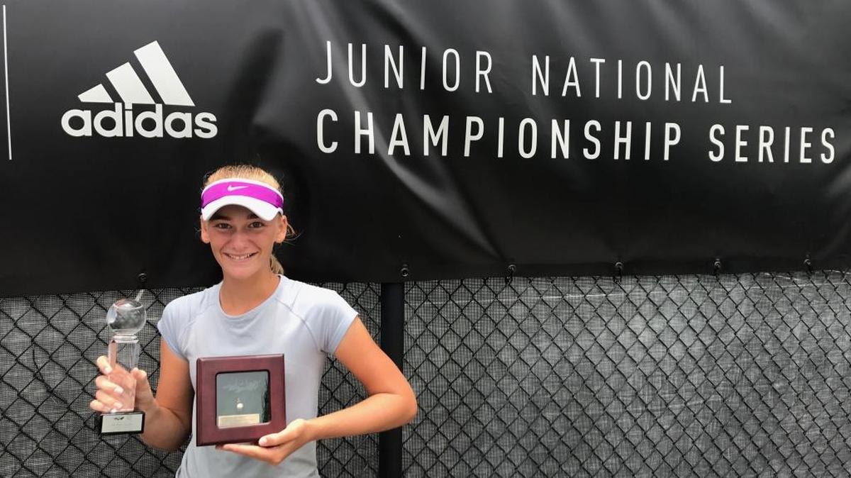Ava Krug holds her trophies for her performance at the USTA Girls’ 12 National Clay Court Championships.