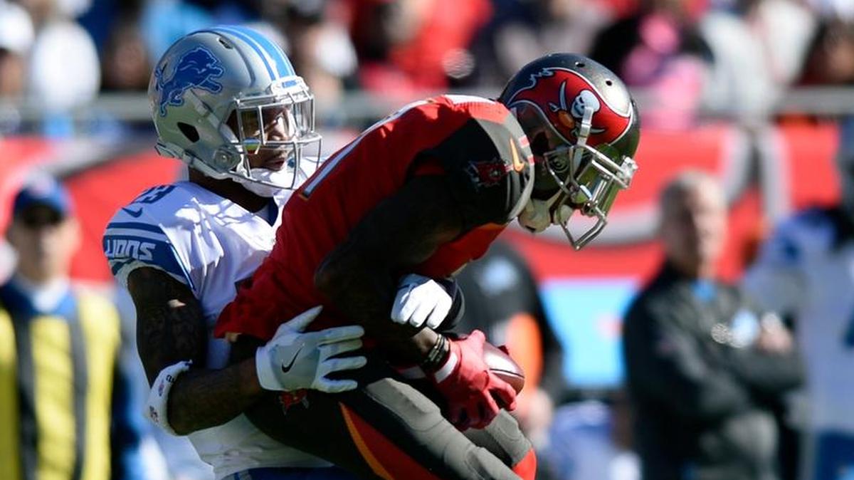 Detroit Lions cornerback Darius Slay (23) stops Tampa Bay Buccaneers wide receiver DeSean Jackson (11) after a catch during the first of a game Dec. 10 in Tampa.