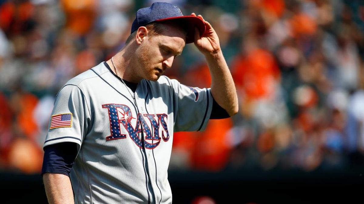 Tampa Bay Rays starting pitcher Alex Cobb walks off the field after being removed in the seventh inning of Sunday’s game.