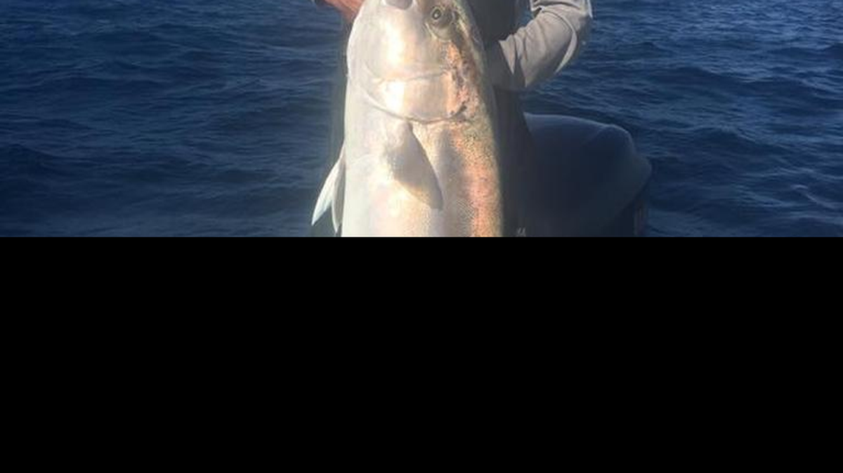 Justin Gray holds one of the tuna the group caught during a recent offshore trip in the Gulf of Mexico.