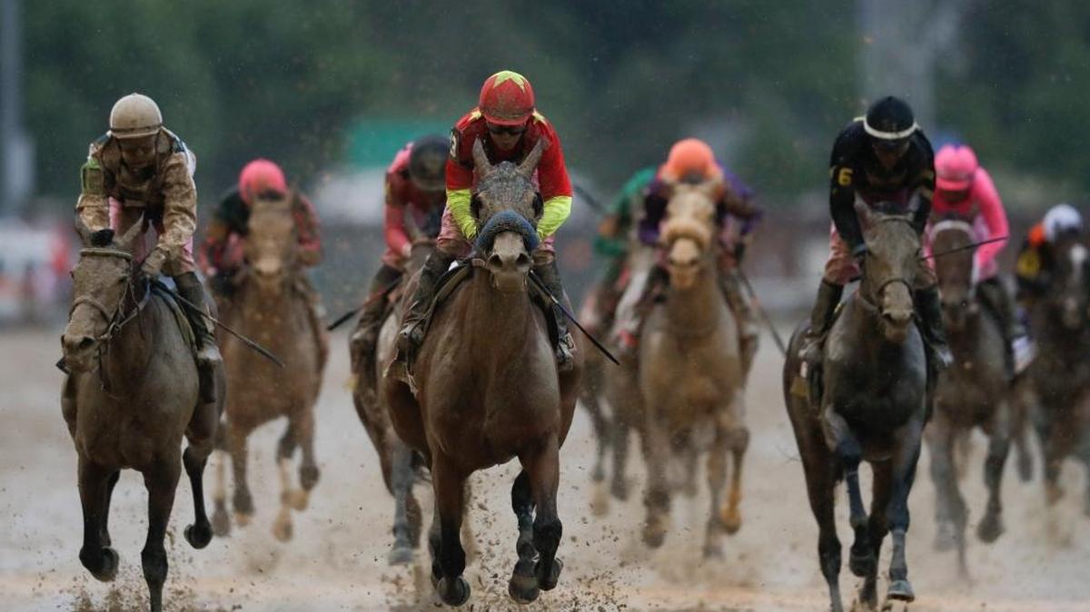 Mike Smith rides Abel Tasman to victory in the 143rd running of the Kentucky Oaks horse race at Churchill Downs Friday in Louisville, Ky.