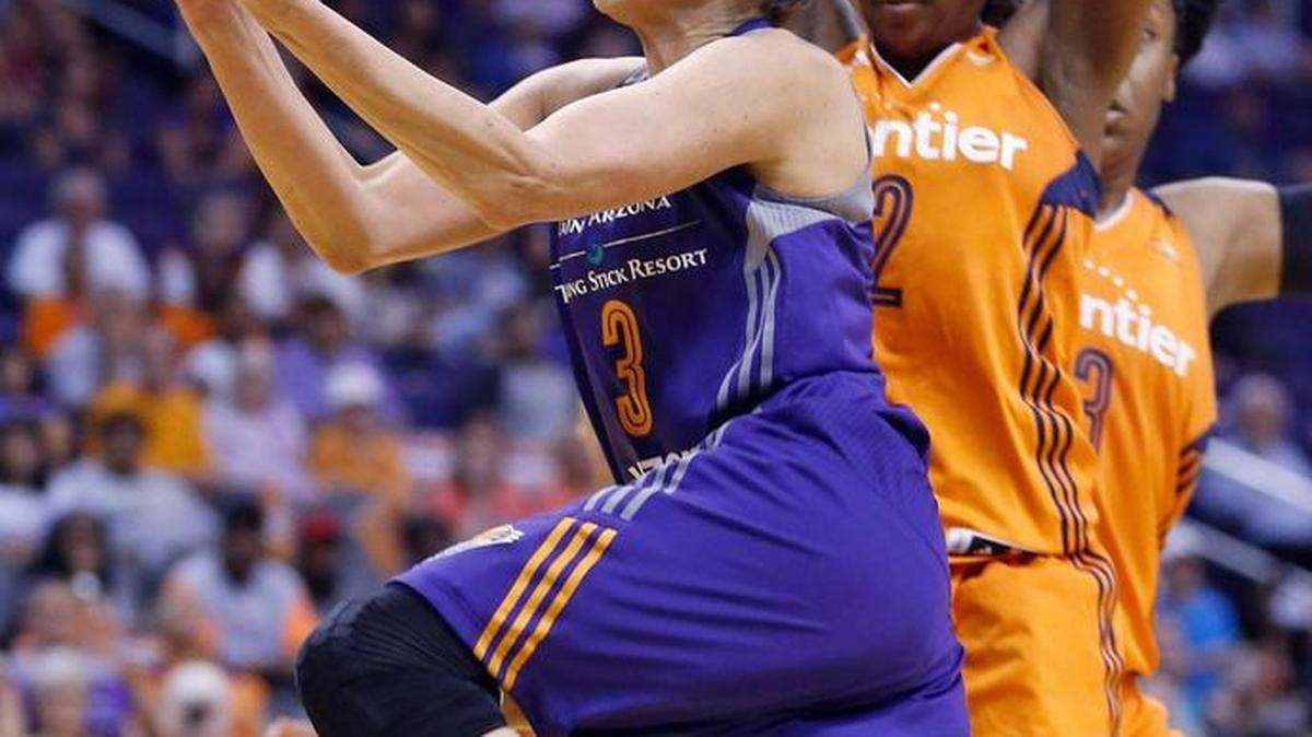 In this May 31 file photo, Phoenix Mercury’s Diana Taurasi drives past Connecticut Sun’s Camille Little (2) and Kelsey Bone (3) to score during the second half of a WNBA basketball game in Phoenix. With nine players, including Taurasi, returning from the London Games, the U.S. is a heavy favorite to win another gold medal in Rio.